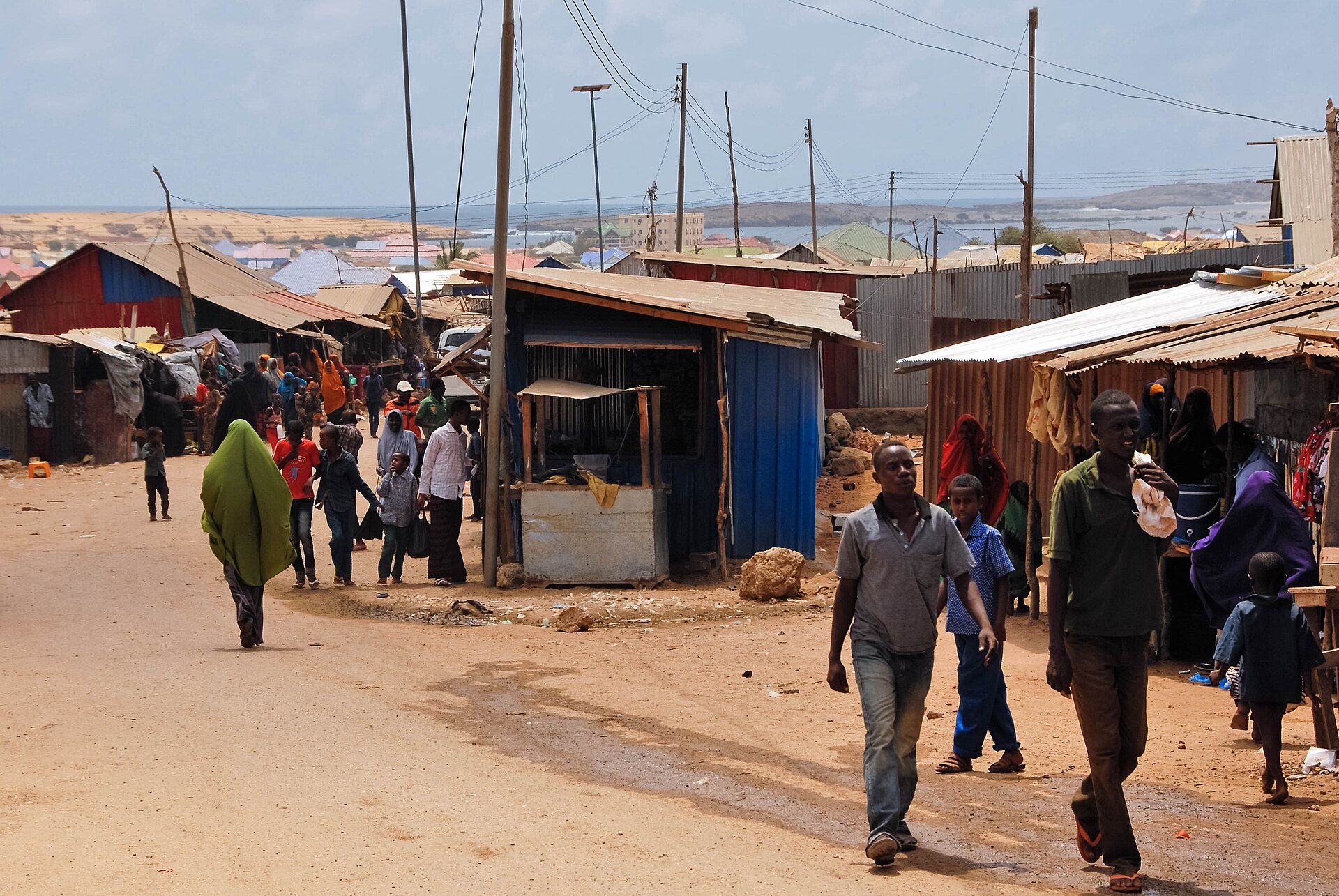 A market street in Kismayo, southern Somalia, with the coast in the distance
