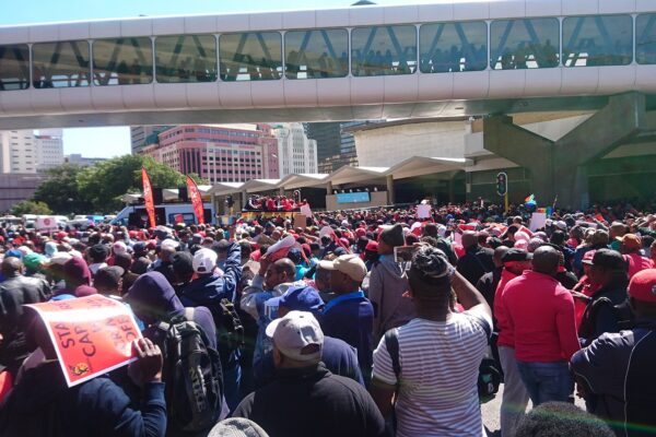 Cosatu members march in central Cape Town, South Africa, carrying orange Cosatu placards