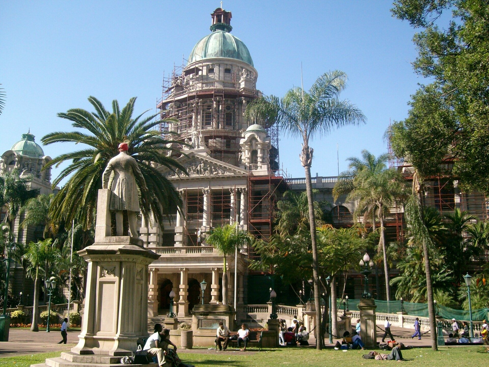 Durban City Hall with its green dome, palm trees and memorial gardens in central Durban, South Africa