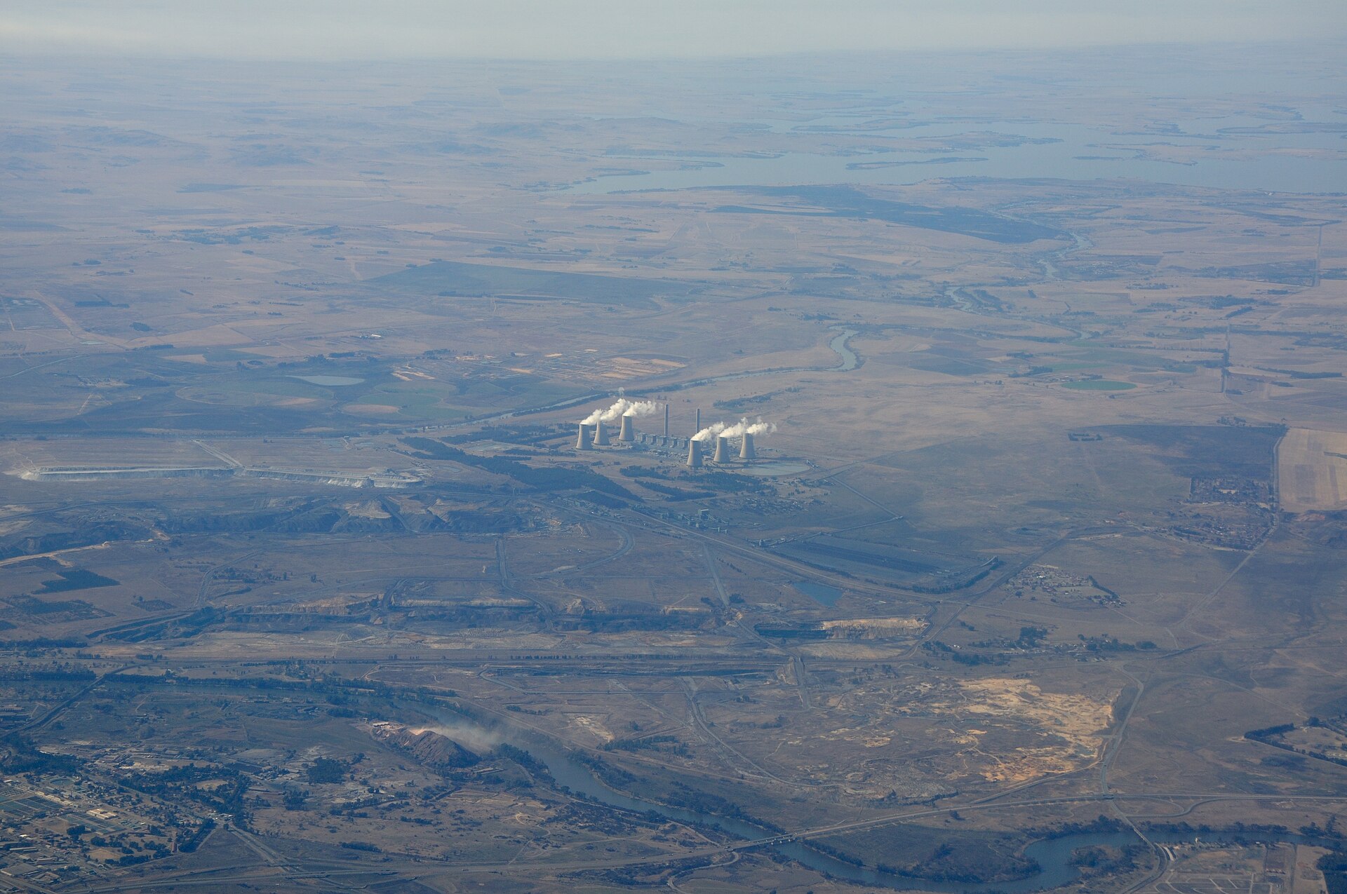 Aerial view of the Lethabo coal-fired power station near Vereeniging, South Africa, with steam rising from its cooling towers