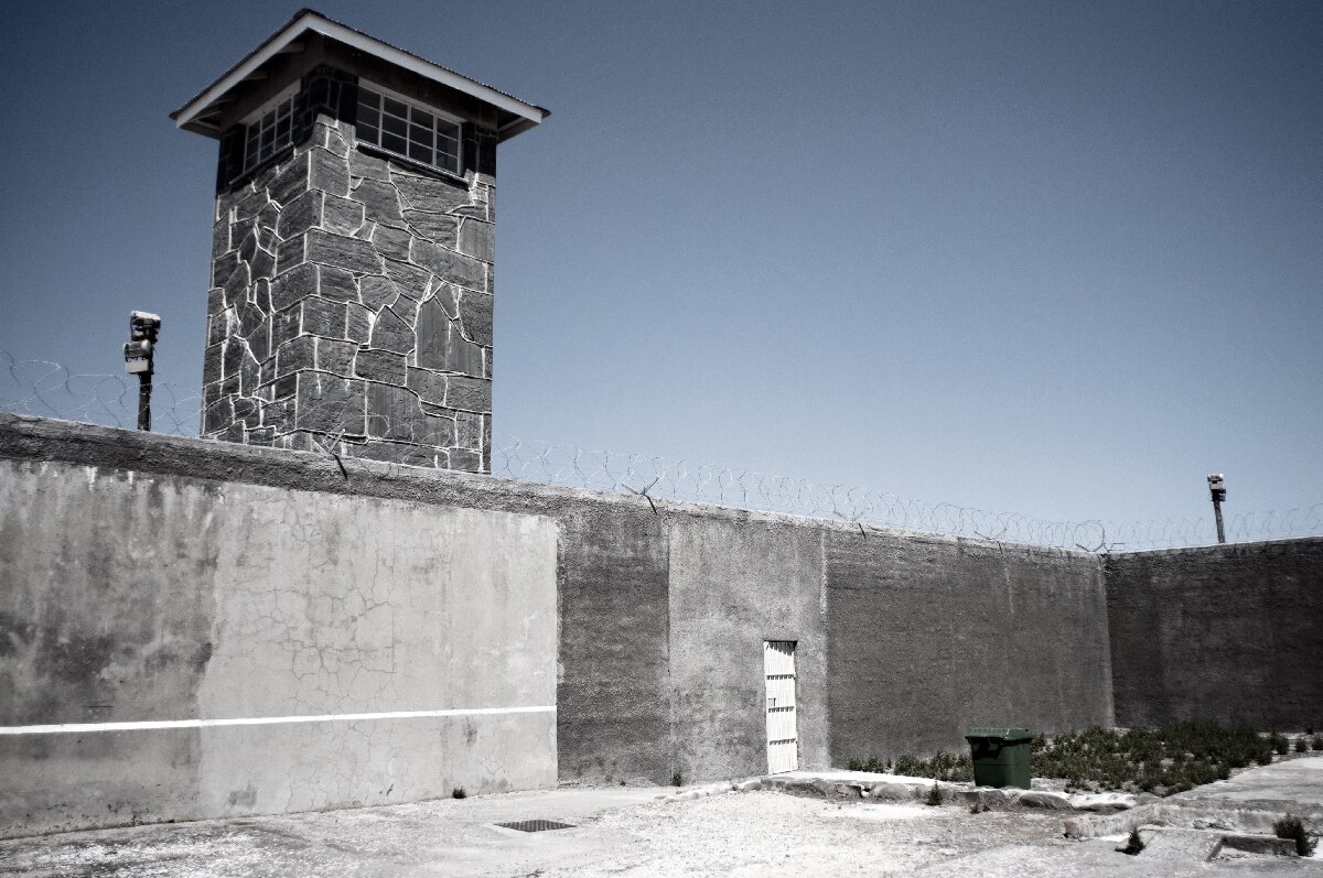South Africa history: prison walls and a guard tower on Robben Island