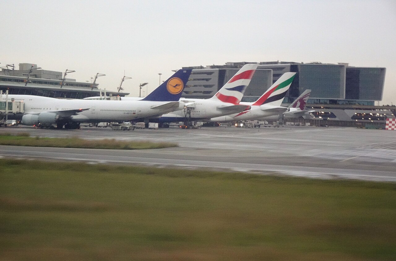 Four passenger jets parked nose-in at the gates of O. R. Tambo International Airport in Johannesburg