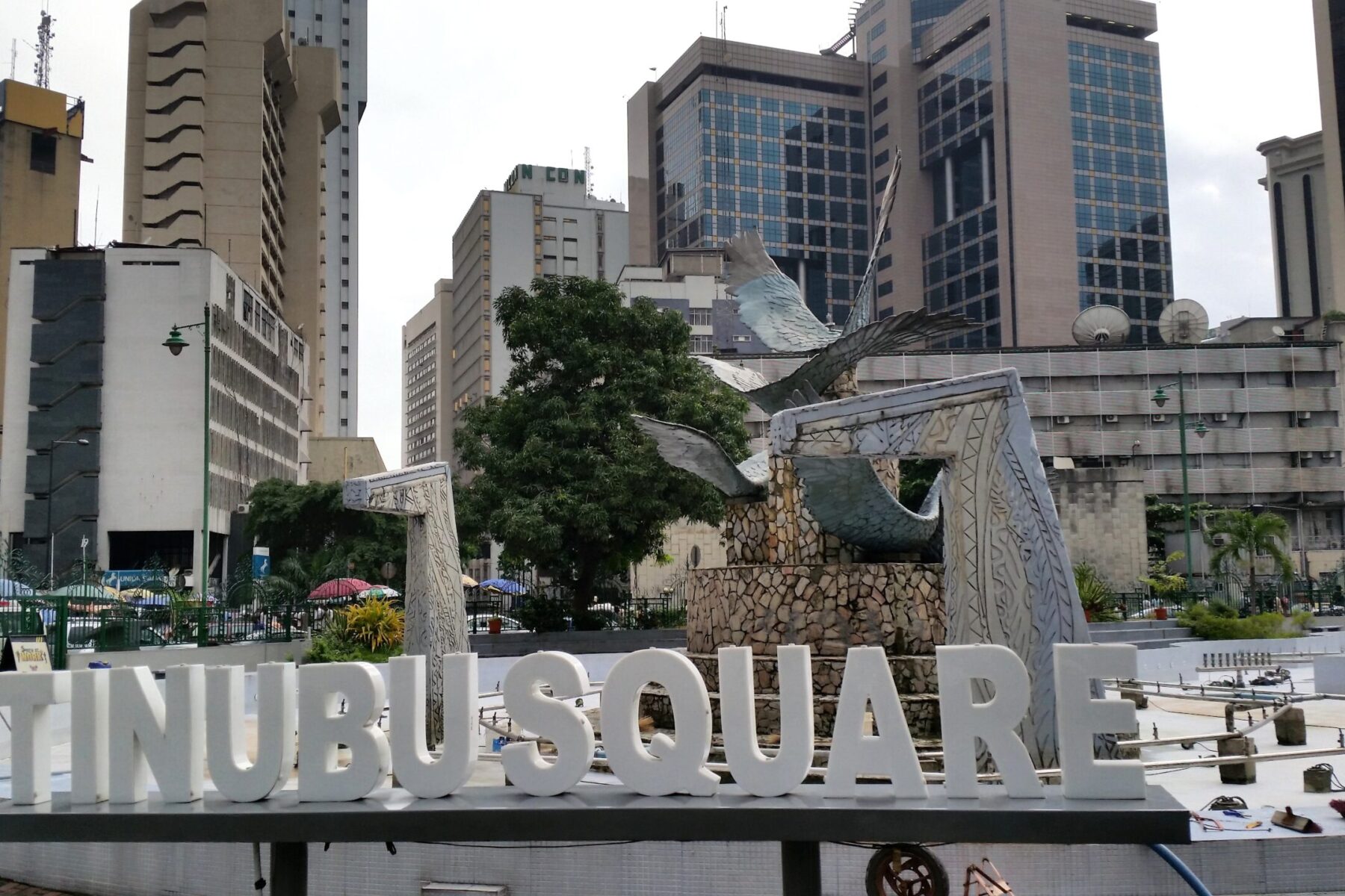Tinubu Square in central Lagos, with its bird sculpture, white lettering and office towers behind