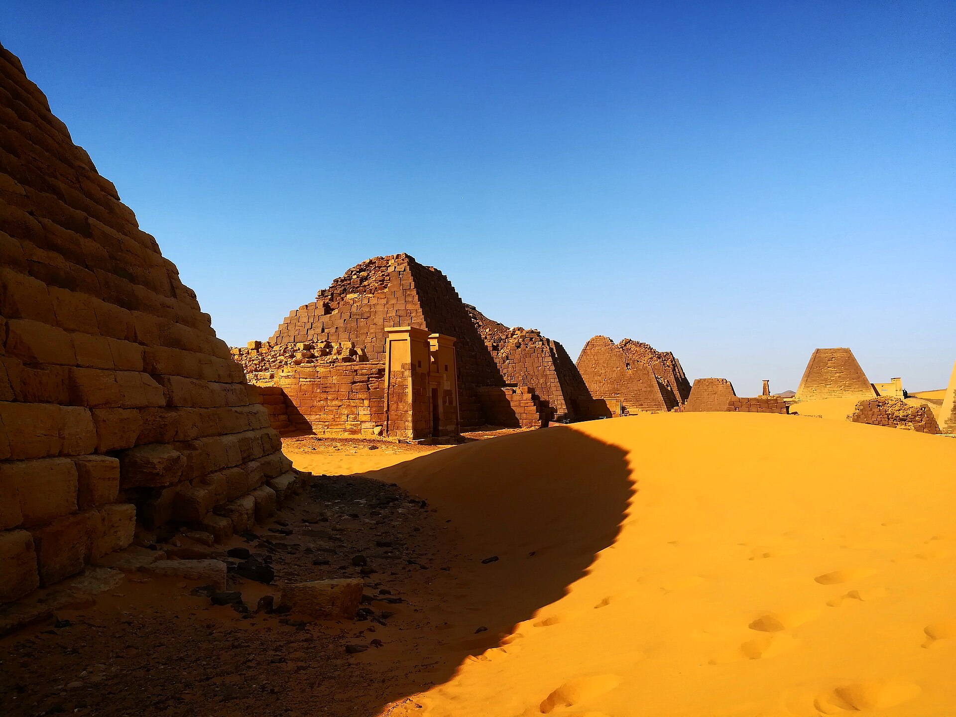 Pyramids and desert dunes at Meroe, Sudan