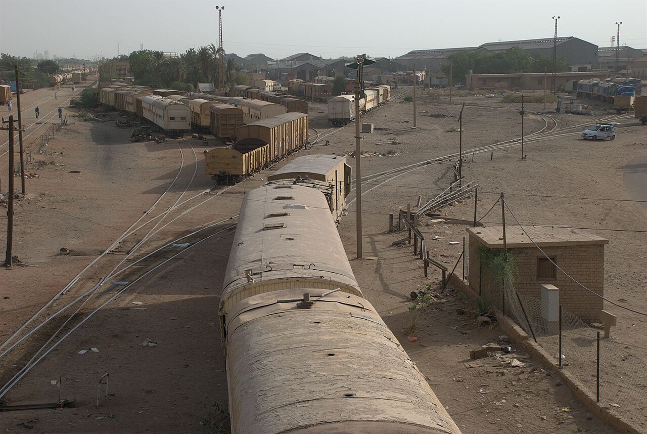 Railway carriages and tracks in the railway workshop area of Atbara, Sudan