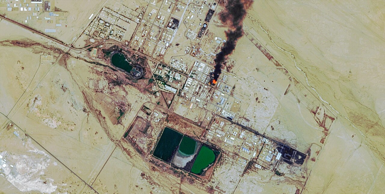 Satellite view of the Al Jaili oil refinery north of Khartoum with a column of black smoke rising from one unit
