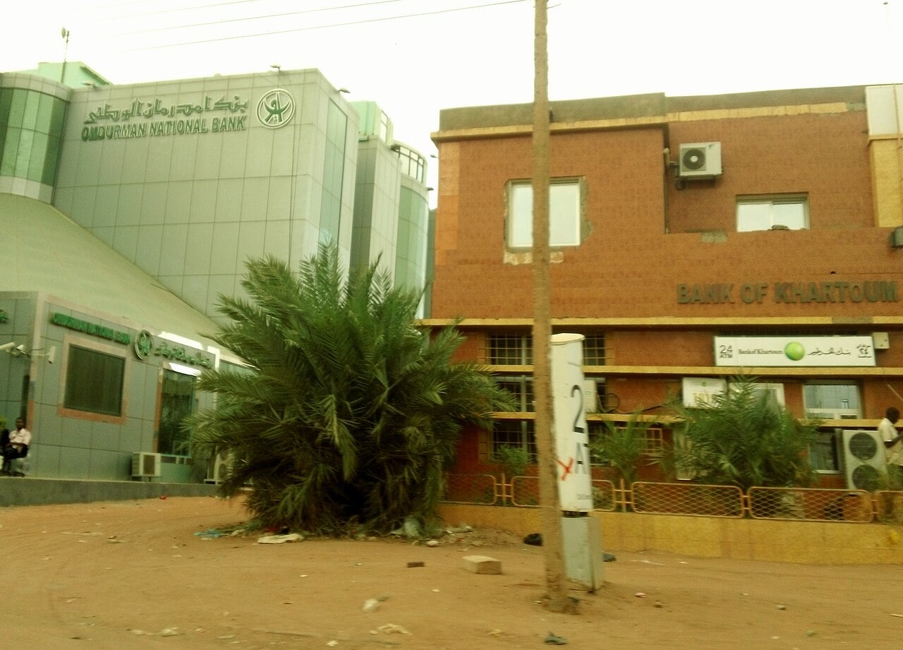 Omdurman National Bank and Bank of Khartoum buildings on a sandy street in Omdurman, Sudan