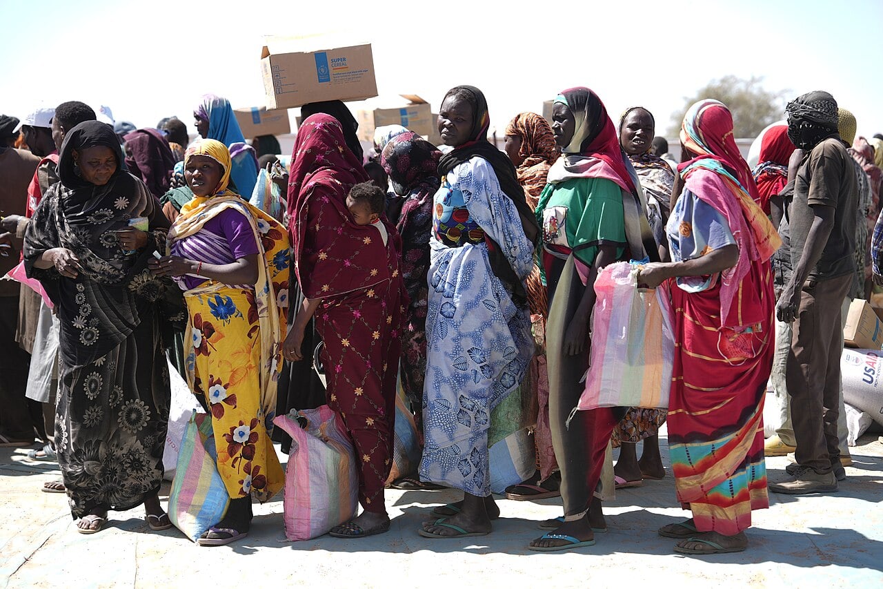 Sudanese refugees queue to register for food aid at the Adre border crossing in eastern Chad