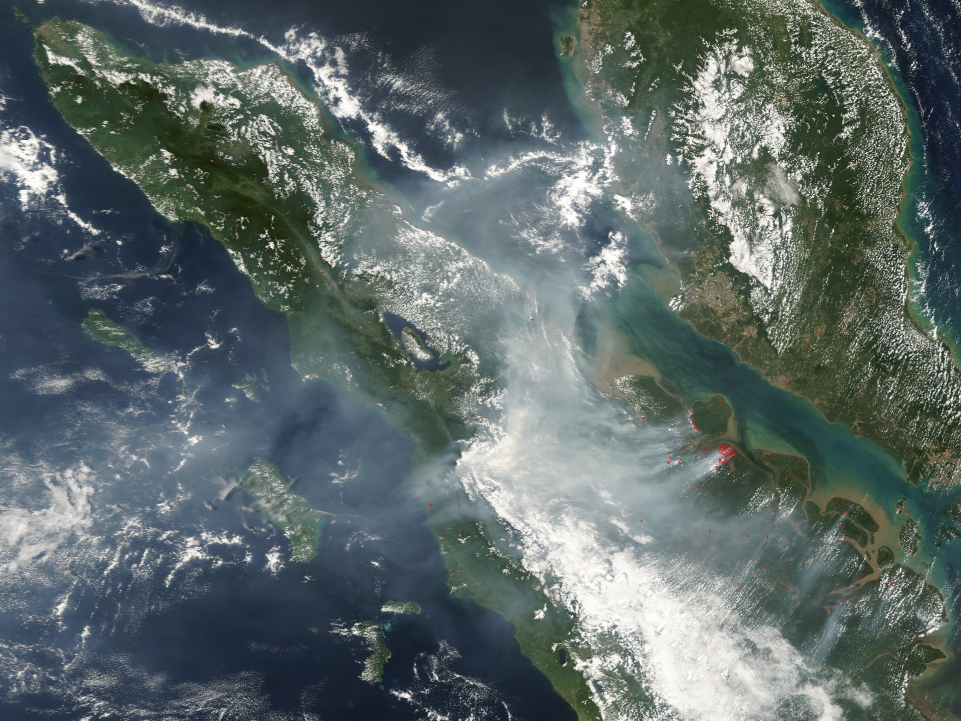 Satellite image of fires and smoke across Sumatra and Malaysia