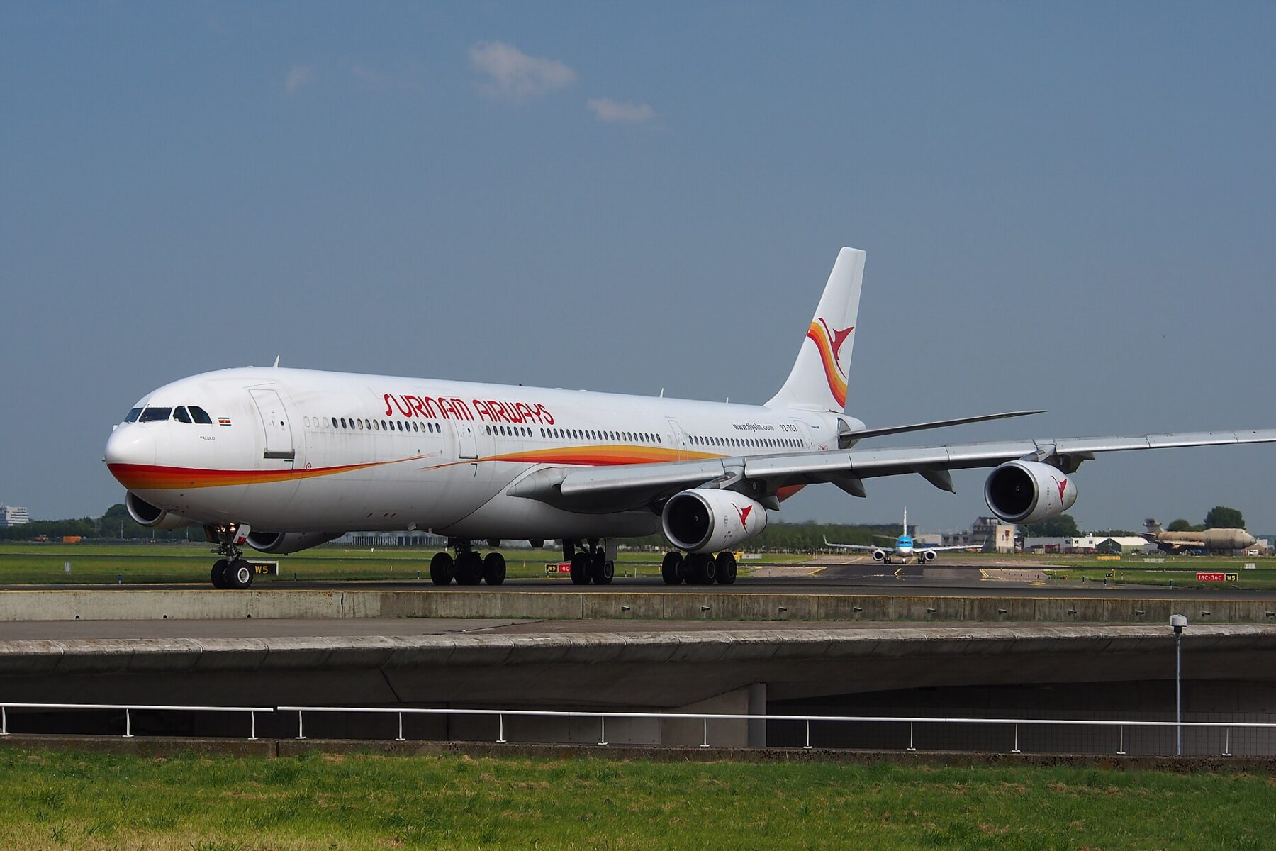 A Surinam Airways Airbus A340 taxiing at Amsterdam Schiphol airport
