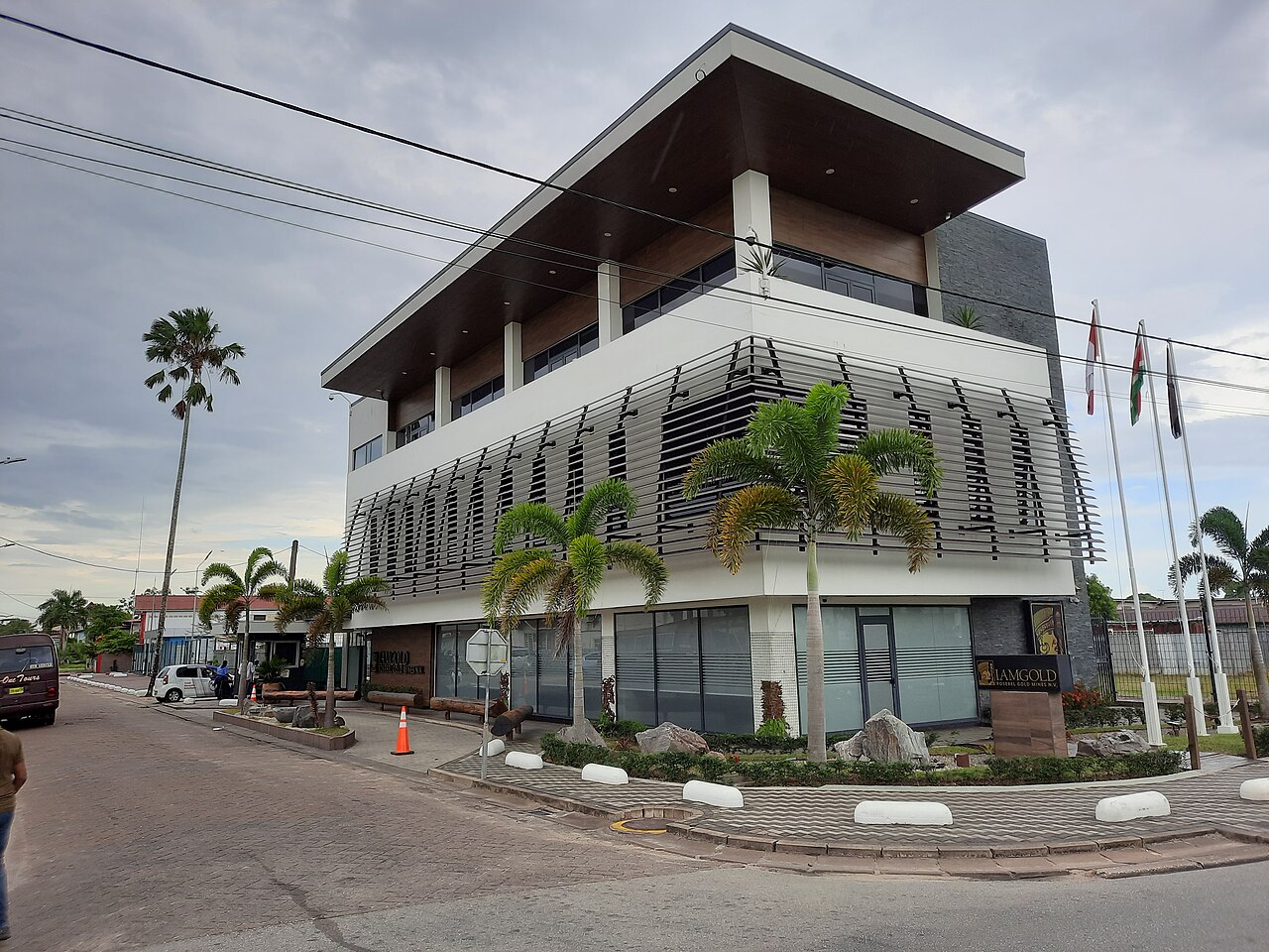 Paramaribo office building of Rosebel Gold Mines with the IAMGOLD sign at the entrance and three flags