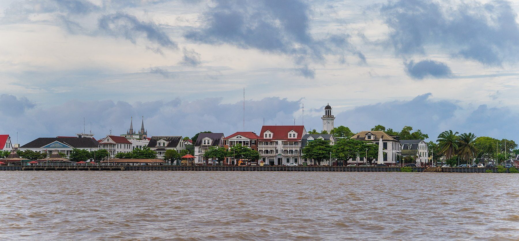 The Paramaribo waterfront seen from the Suriname River, with historic wooden buildings