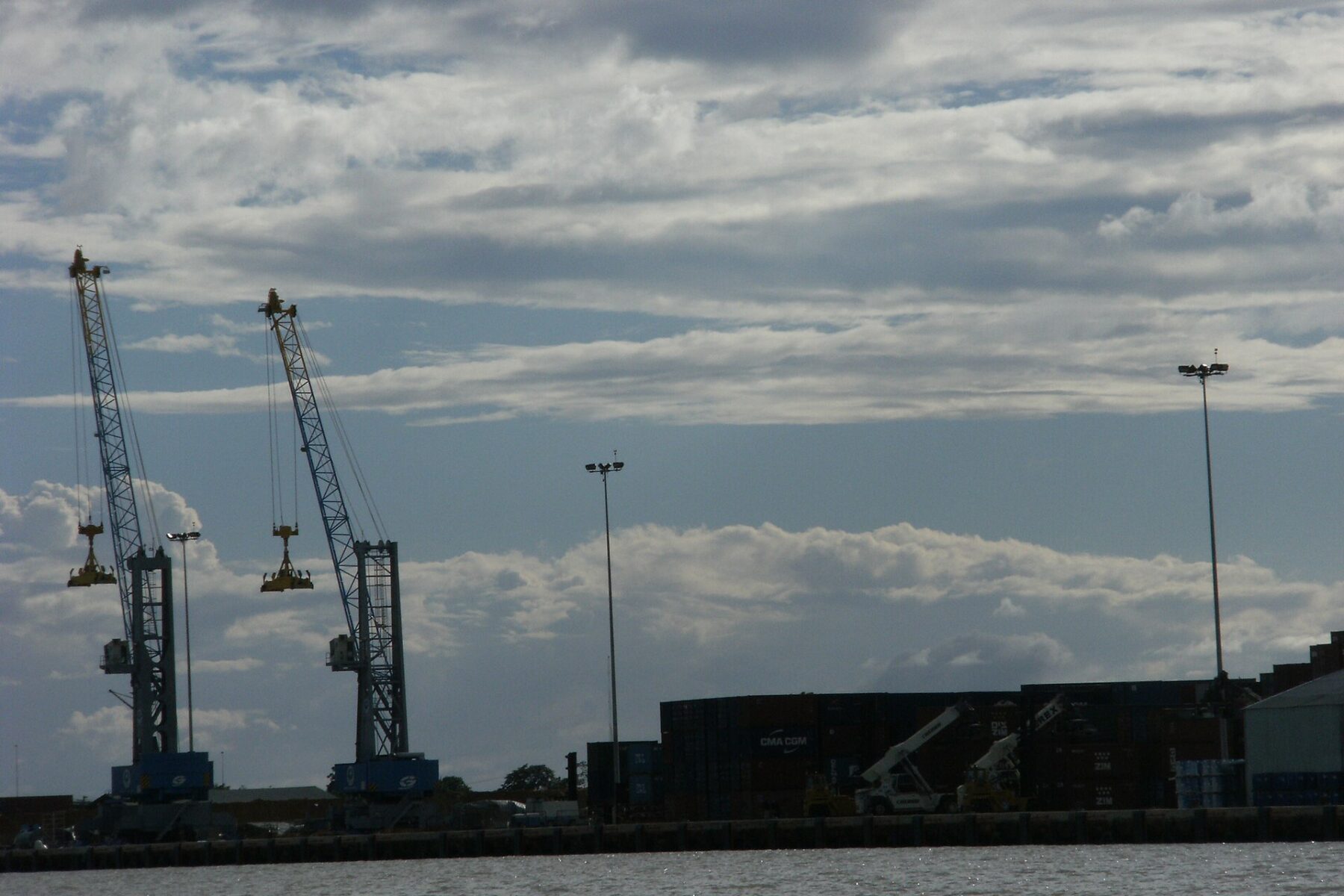 Container cranes and stacked shipping containers at the port of Paramaribo, Suriname