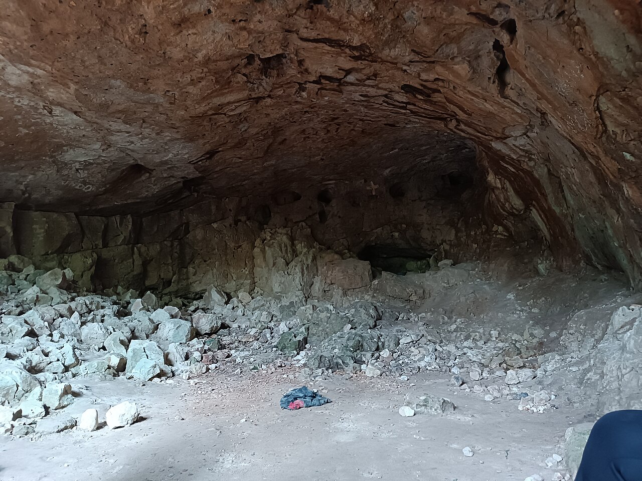 Large rock cave with a rubble floor inside the Pugu Kazimzumbwi forest reserve in Tanzania