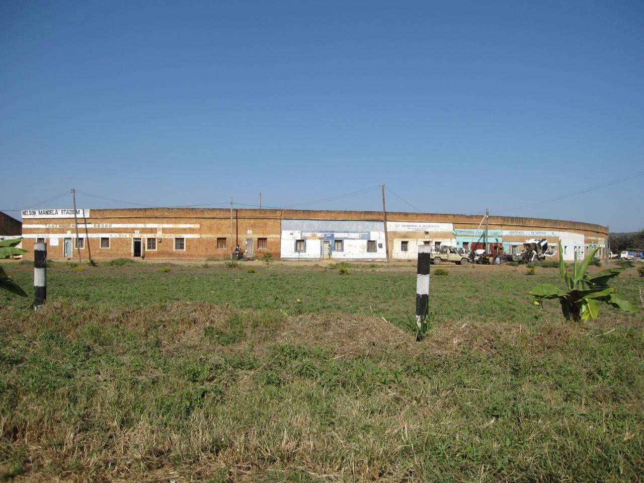 Outer wall of Nelson Mandela Stadium in Sumbawanga, Tanzania, with its name painted above the entrance