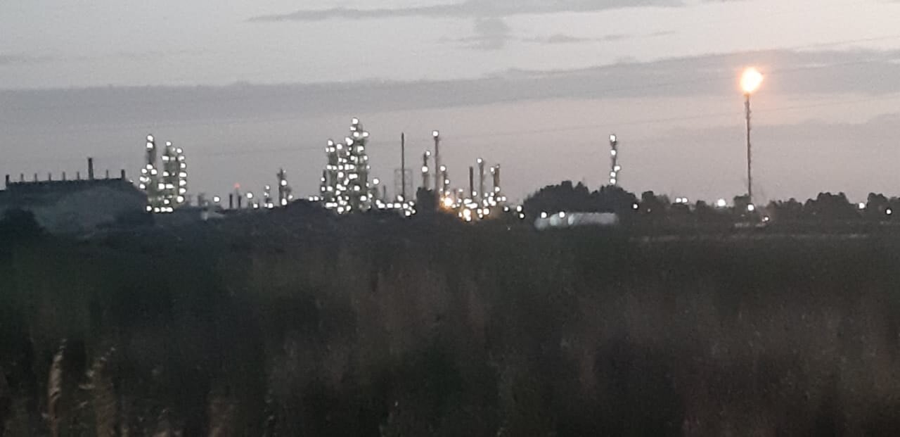 The Bahía Blanca petrochemical complex at dusk with a gas flare, Argentina