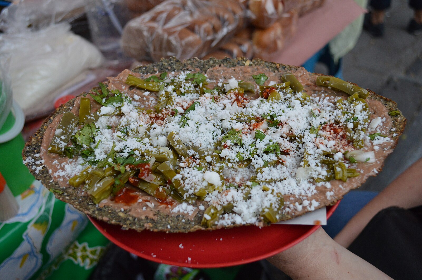 Tlayudas in Mexico City: a street-stand version with beans, nopales and fresh cheese in Coyoacán
