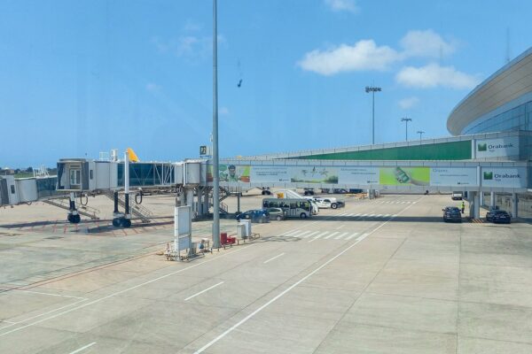 Passenger boarding bridges and the glass terminal at Gnassingbé Eyadéma International Airport in Lomé, Togo
