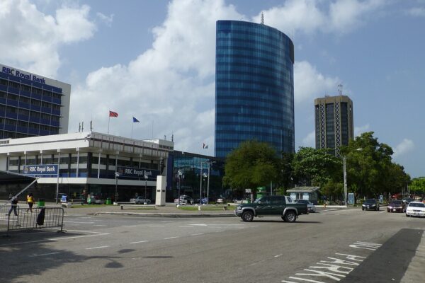Bank branches and a glass office tower beside Independence Square in Port of Spain, Trinidad