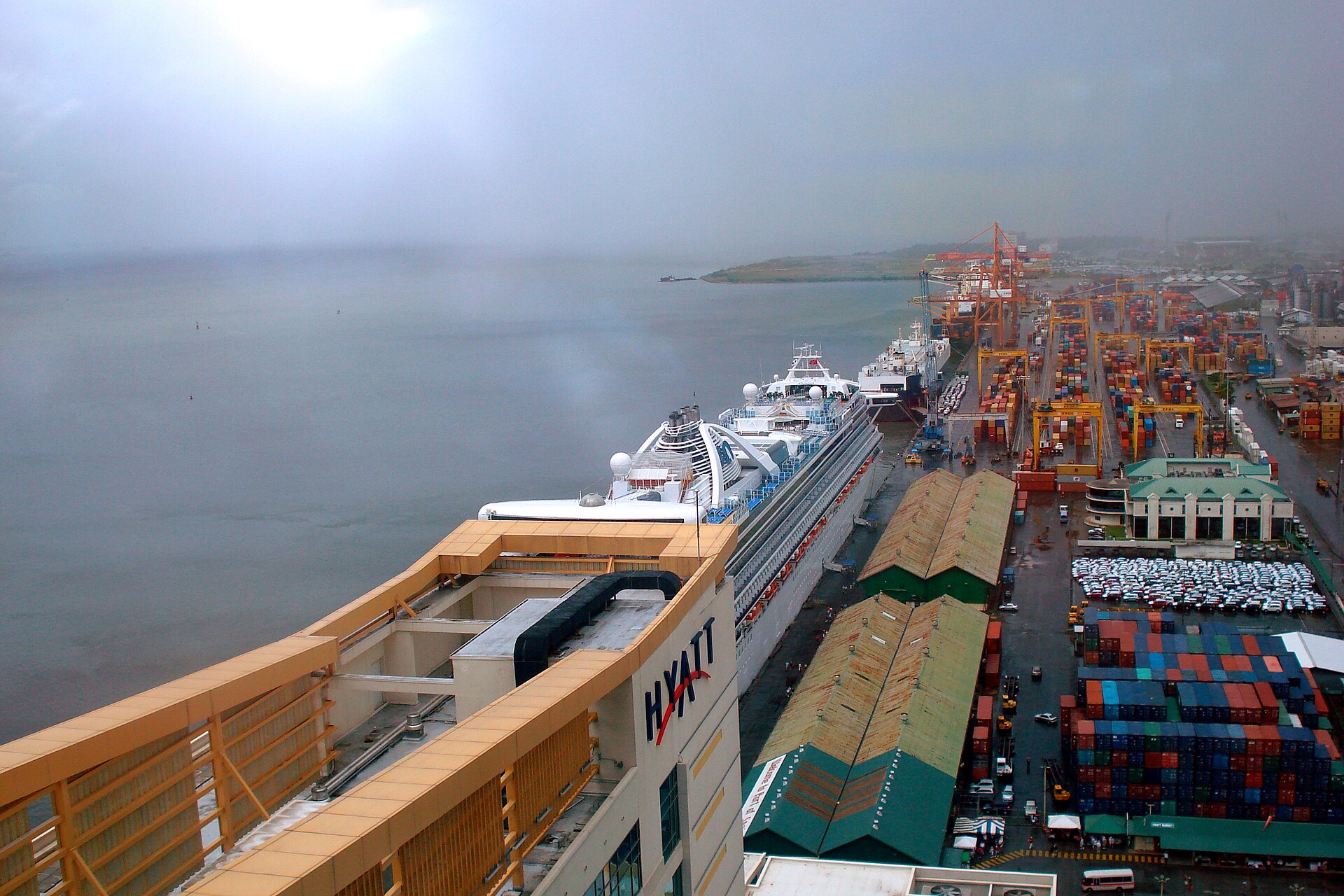 Container yard and a cruise ship at the Port of Spain wharf, Trinidad and Tobago