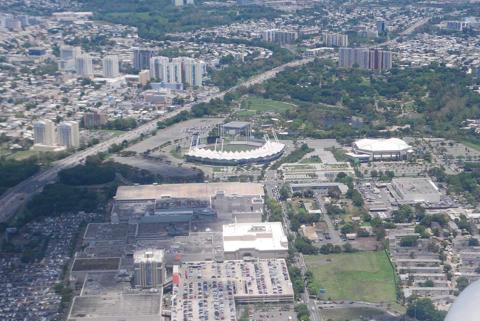 Aerial view of San Juan, Puerto Rico, with a baseball stadium, an indoor arena and a shopping centre
