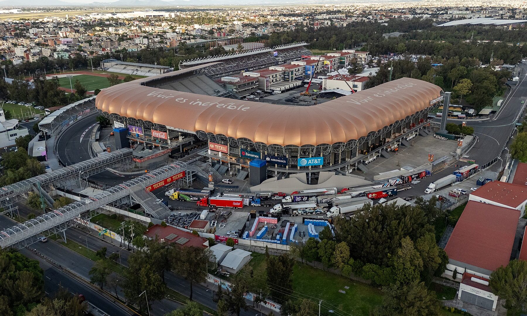Aerial view of Estadio GNP Seguros and the Autódromo Hermanos Rodríguez circuit in Mexico City at dusk