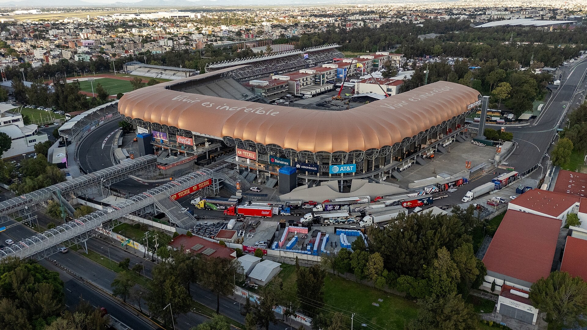 Aerial view of Estadio GNP Seguros and the Autódromo Hermanos Rodríguez circuit in Mexico City at dusk