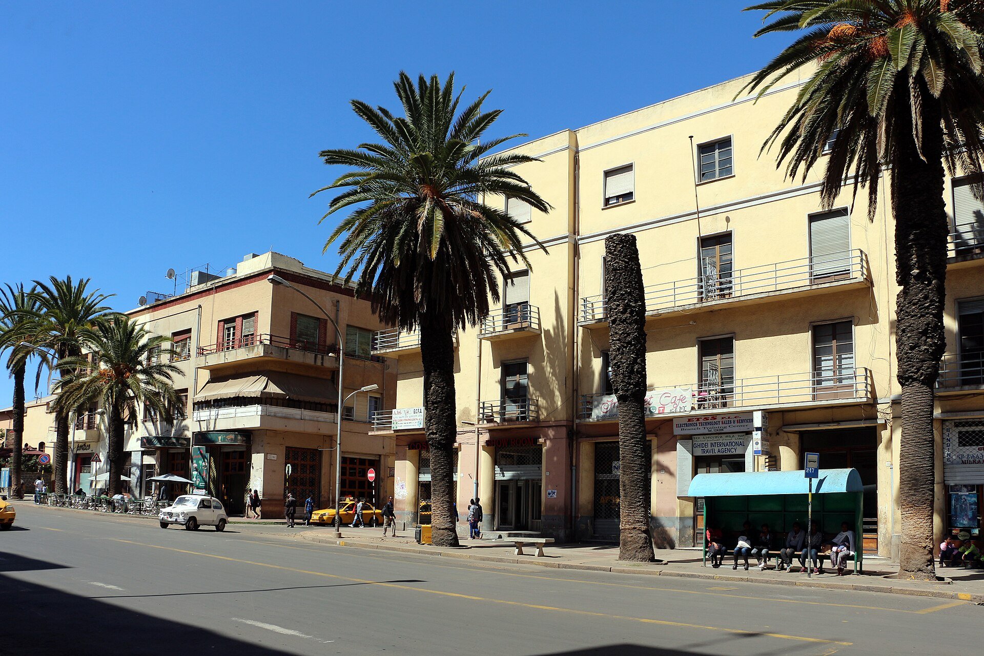 Palm trees and Italian-era buildings along Harnet Avenue in Asmara, the capital of Eritrea