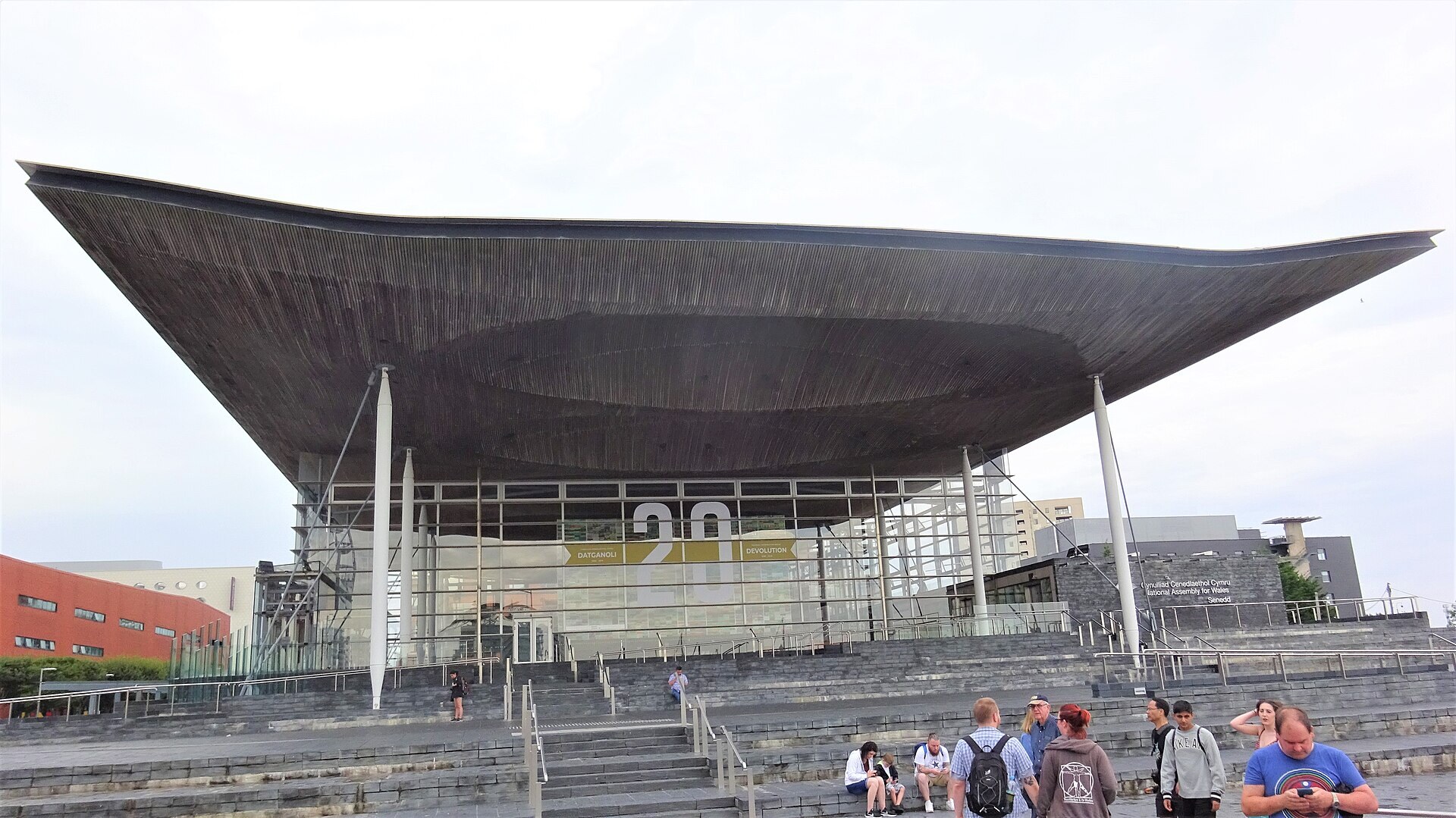 The glass and timber frontage of the Senedd, the Welsh parliament, in Cardiff Bay