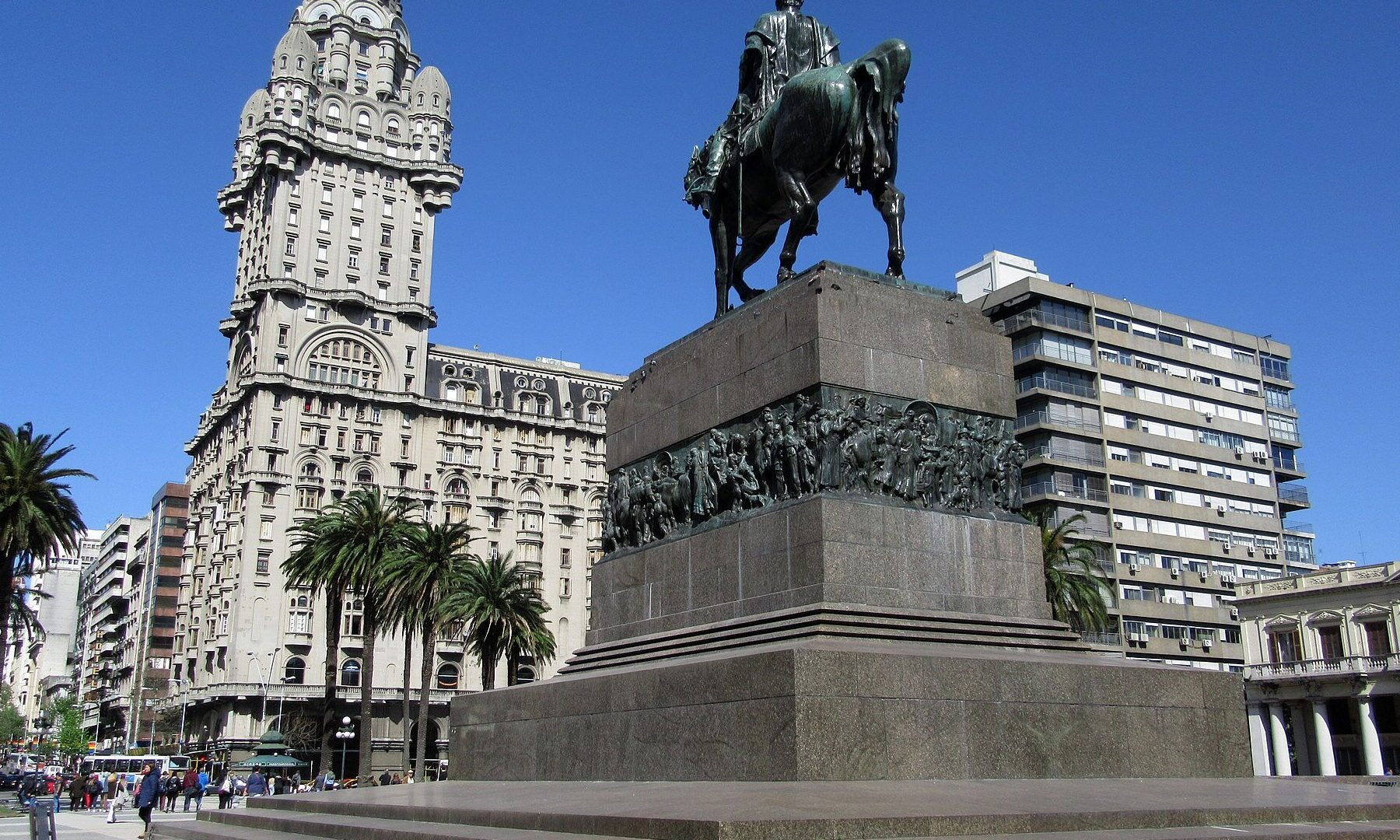 Plaza Independencia in Montevideo with the Palacio Salvo tower and the base of the equestrian statue of Artigas under a blue sky