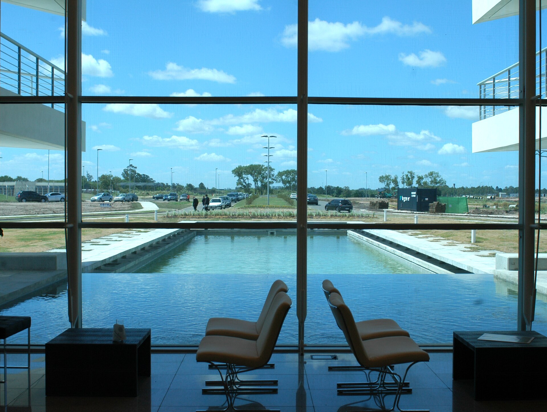 Glass lobby looking onto the grounds of Parque de las Ciencias, a business park in Canelones, Uruguay