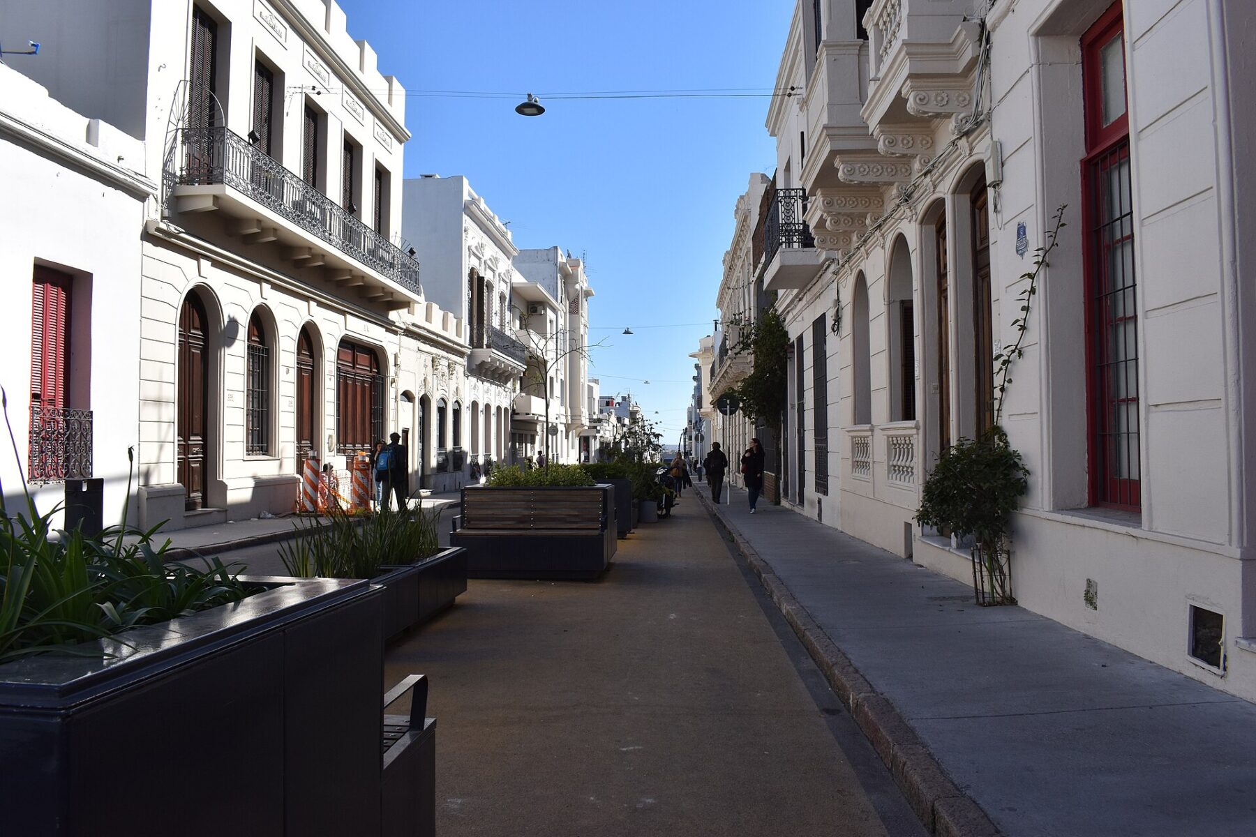 A pedestrian street lined with white colonial buildings in the Ciudad Vieja district of Montevideo, Uruguay