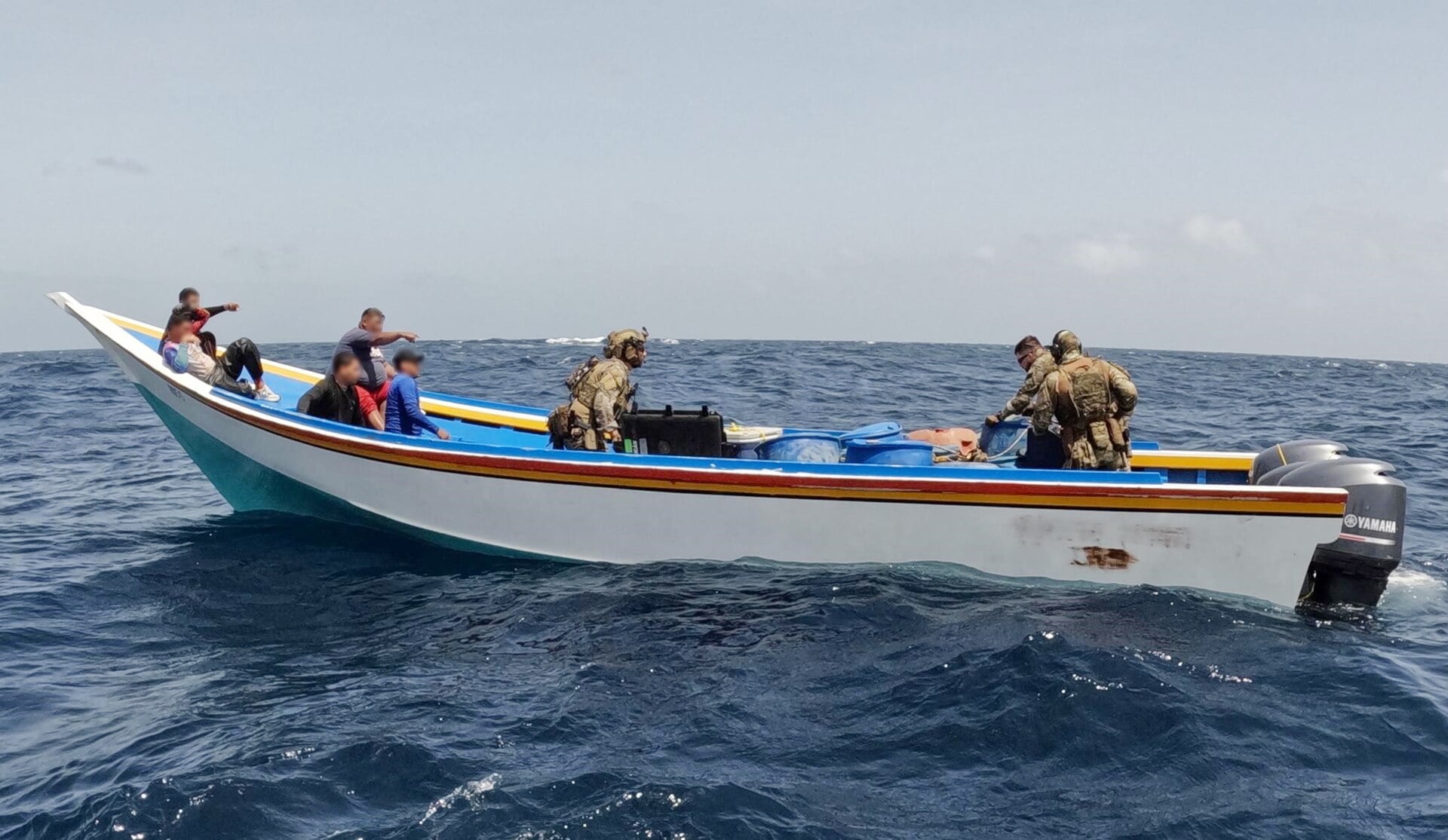 US Coast Guard officers board a suspected drug smuggling boat off Venezuela in the Caribbean