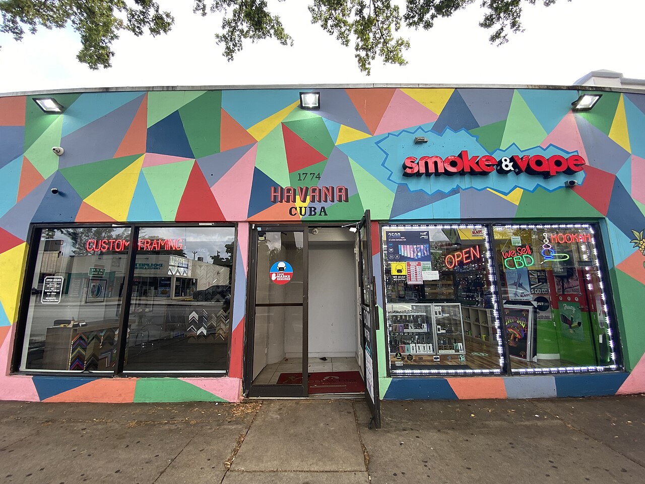 Colourful geometric mural on a Little Havana shopfront on Calle Ocho in Miami with a sign reading Havana Cuba