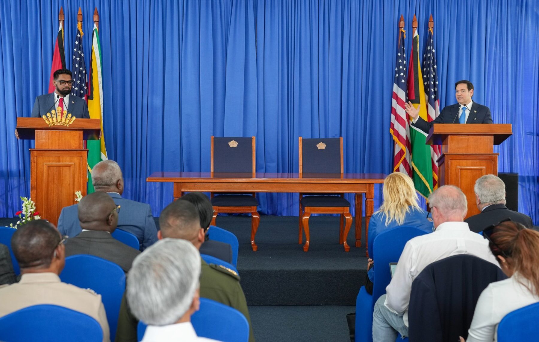 US Secretary of State Marco Rubio and Guyana's President Irfaan Ali speak at lecterns during a joint news conference in Georgetown, Guyana