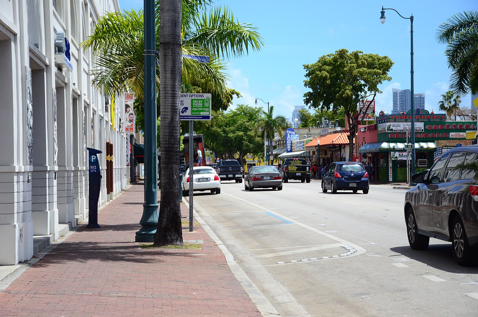 A street with restaurants and palm trees in Little Havana, Miami, Florida, United States