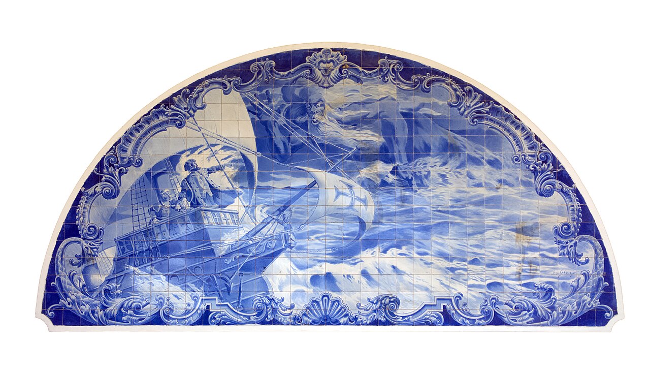 A half-round blue and white tile panel showing a sailing ship in a storm, at the main entrance of the Vasco da Gama stadium in Rio de Janeiro.