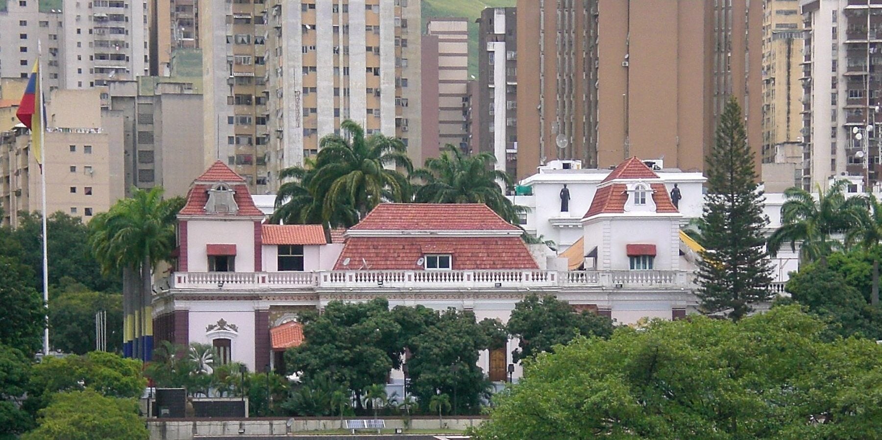 Miraflores Palace, the presidential office in Caracas, Venezuela, with apartment towers behind