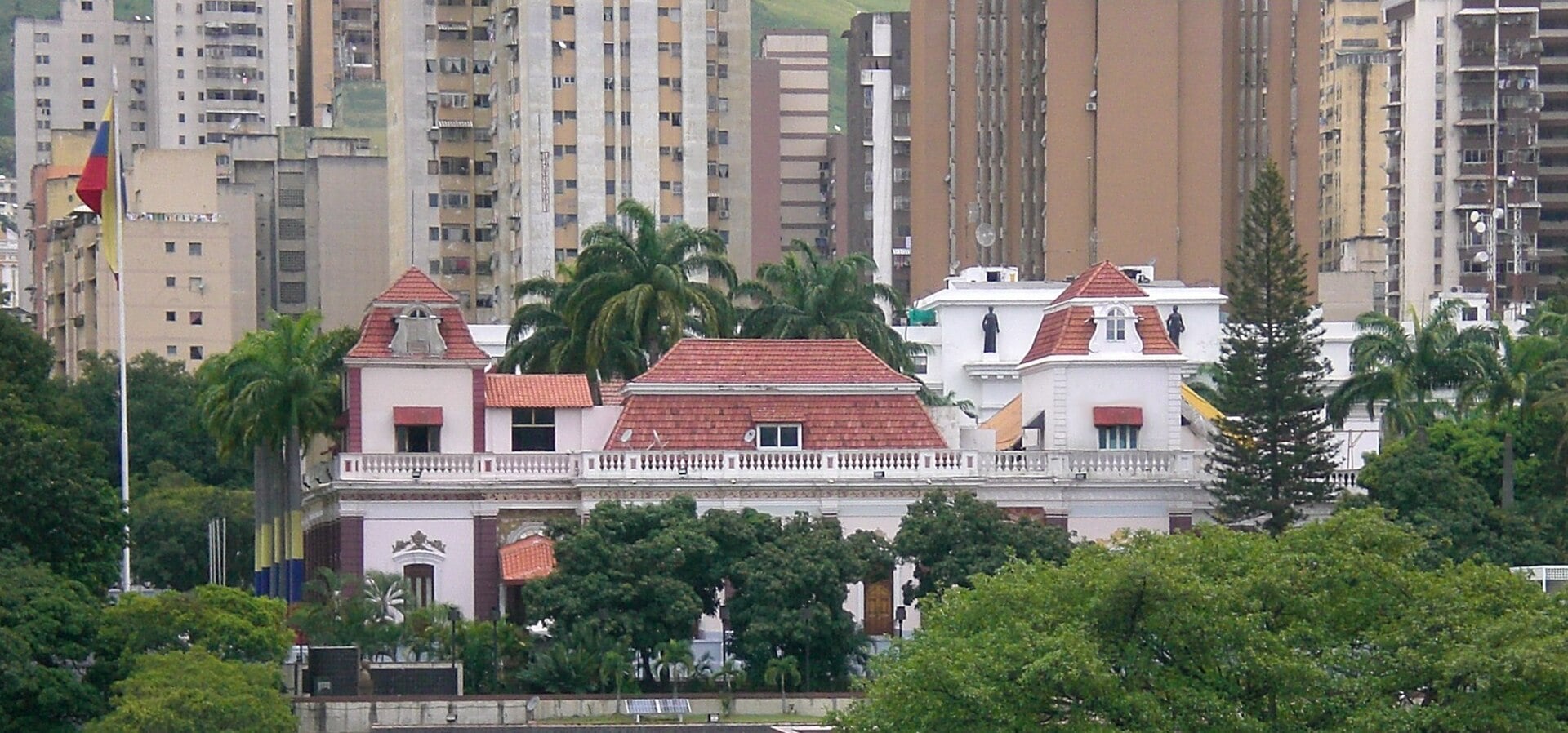 Miraflores Palace, the presidential office in Caracas, Venezuela, with apartment towers behind
