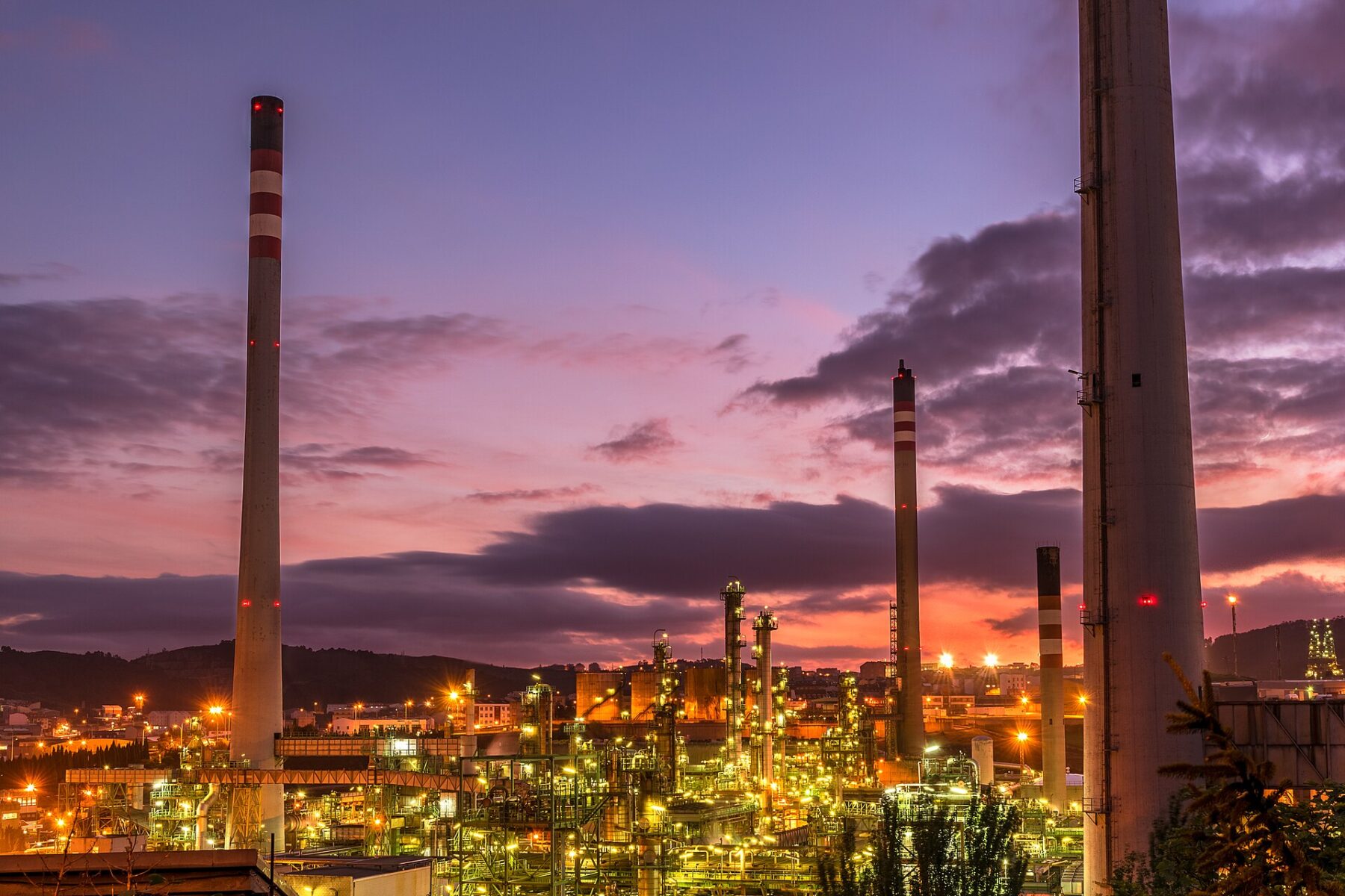 Repsol oil refinery in A Coruña, Spain, lit up at dusk
