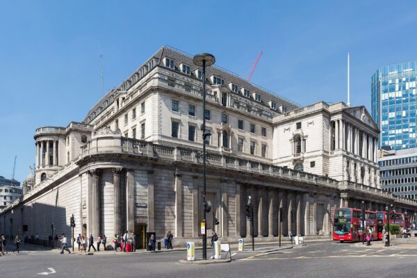 The Bank of England building in the City of London seen from the street corner near Lombard Street on a sunny day