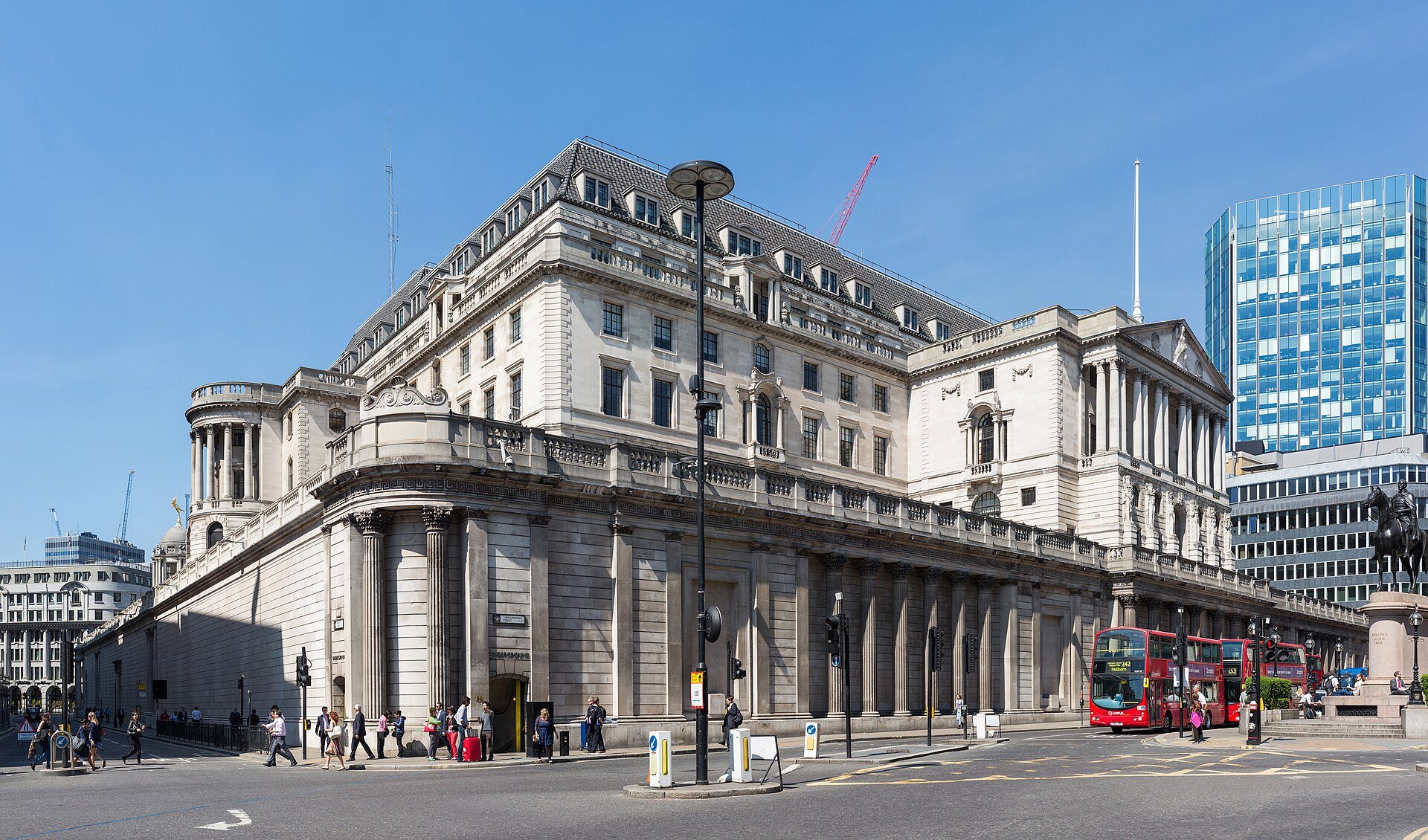 The Bank of England building in the City of London seen from the street corner near Lombard Street on a sunny day