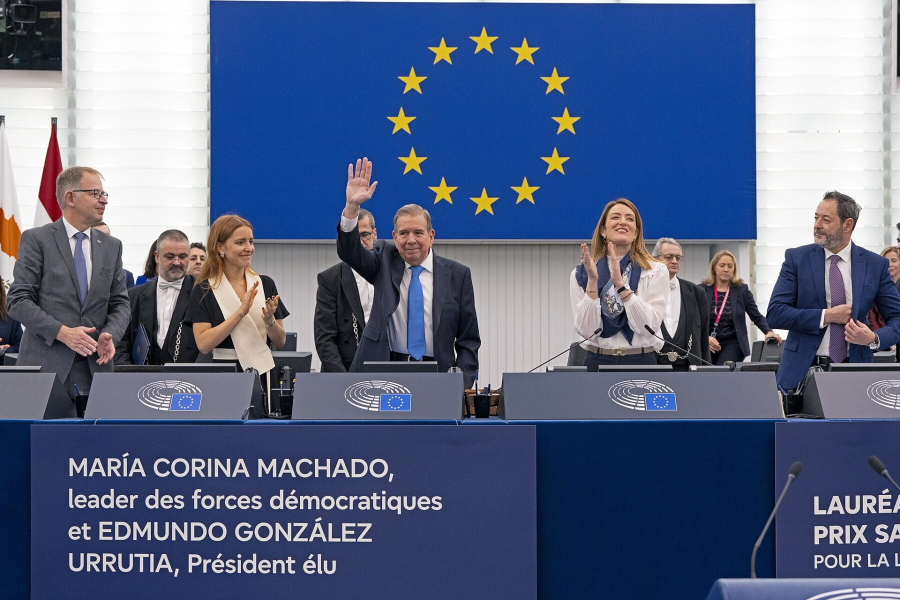 Edmundo González waves in the European Parliament chamber in Strasbourg