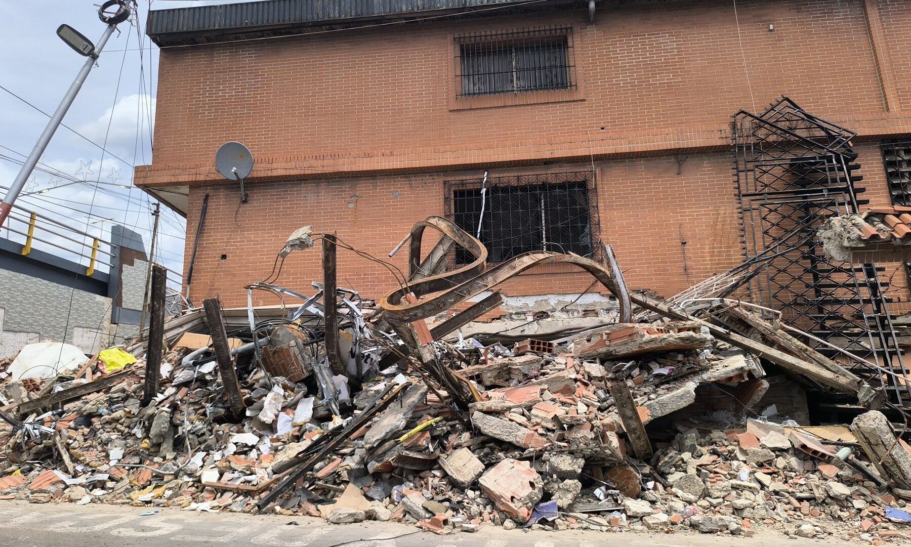 A building in Catia La Mar, La Guaira state, Venezuela, reduced to rubble after the 24 June 2026 earthquakes
