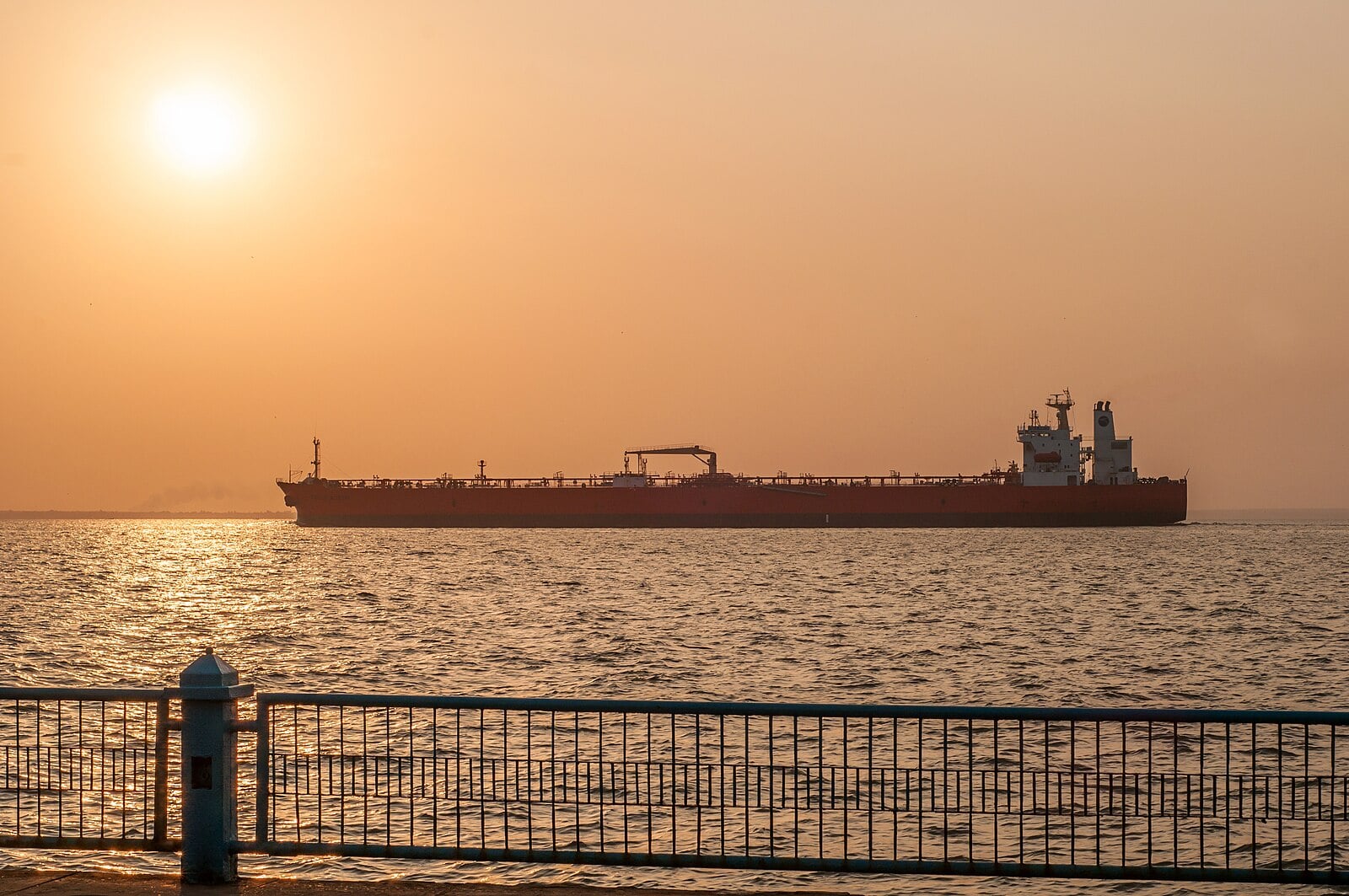 A crude oil tanker sails across Lake Maracaibo at sunrise, Zulia state, Venezuela