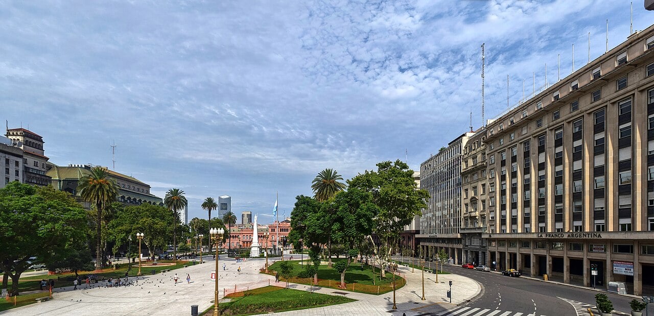 Plaza de Mayo in Buenos Aires with the pink Casa Rosada presidential palace at the far end and office buildings along Avenida Hipólito Yrigoyen on the right
