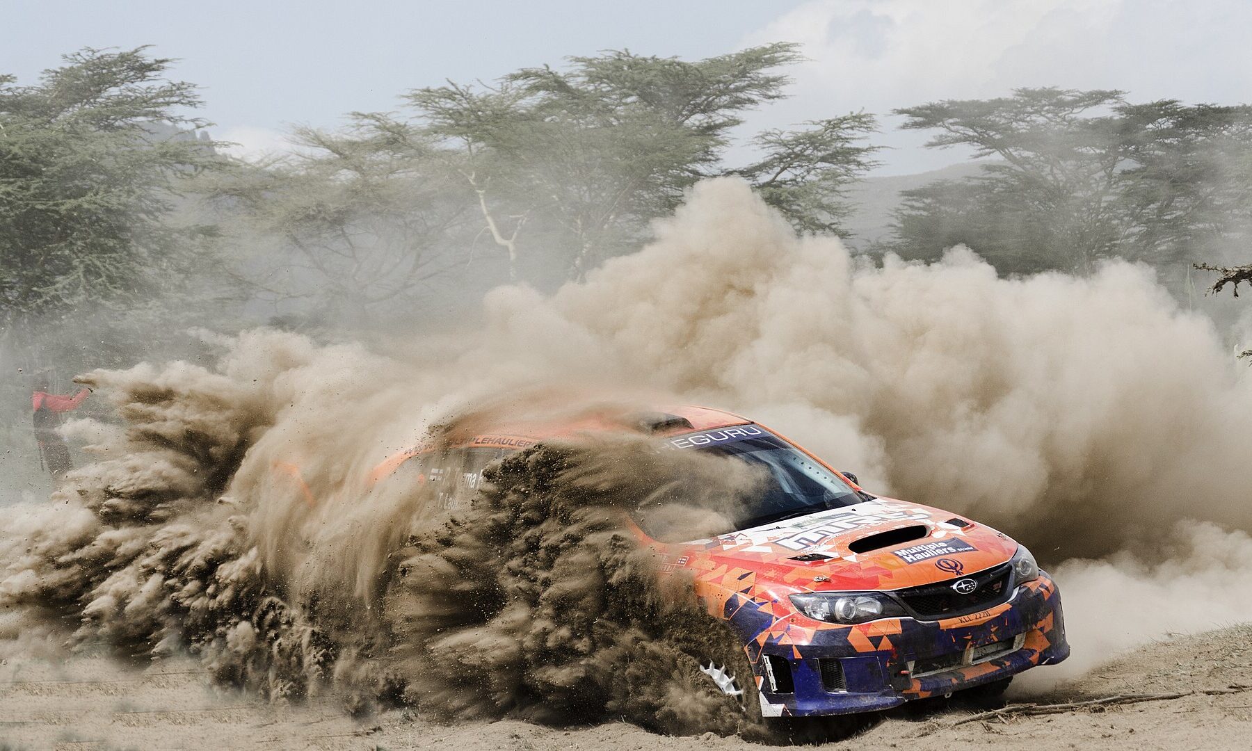A rally car throws up a plume of dust on a gravel stage near Naivasha, Kenya, host of the 2027 WRC Safari Rally