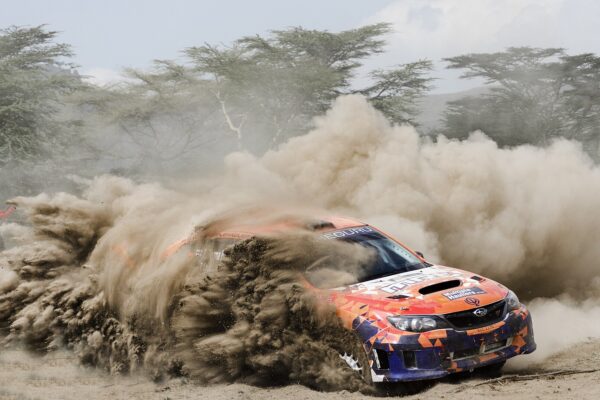 A rally car throws up a plume of dust on a gravel stage near Naivasha, Kenya, host of the 2027 WRC Safari Rally