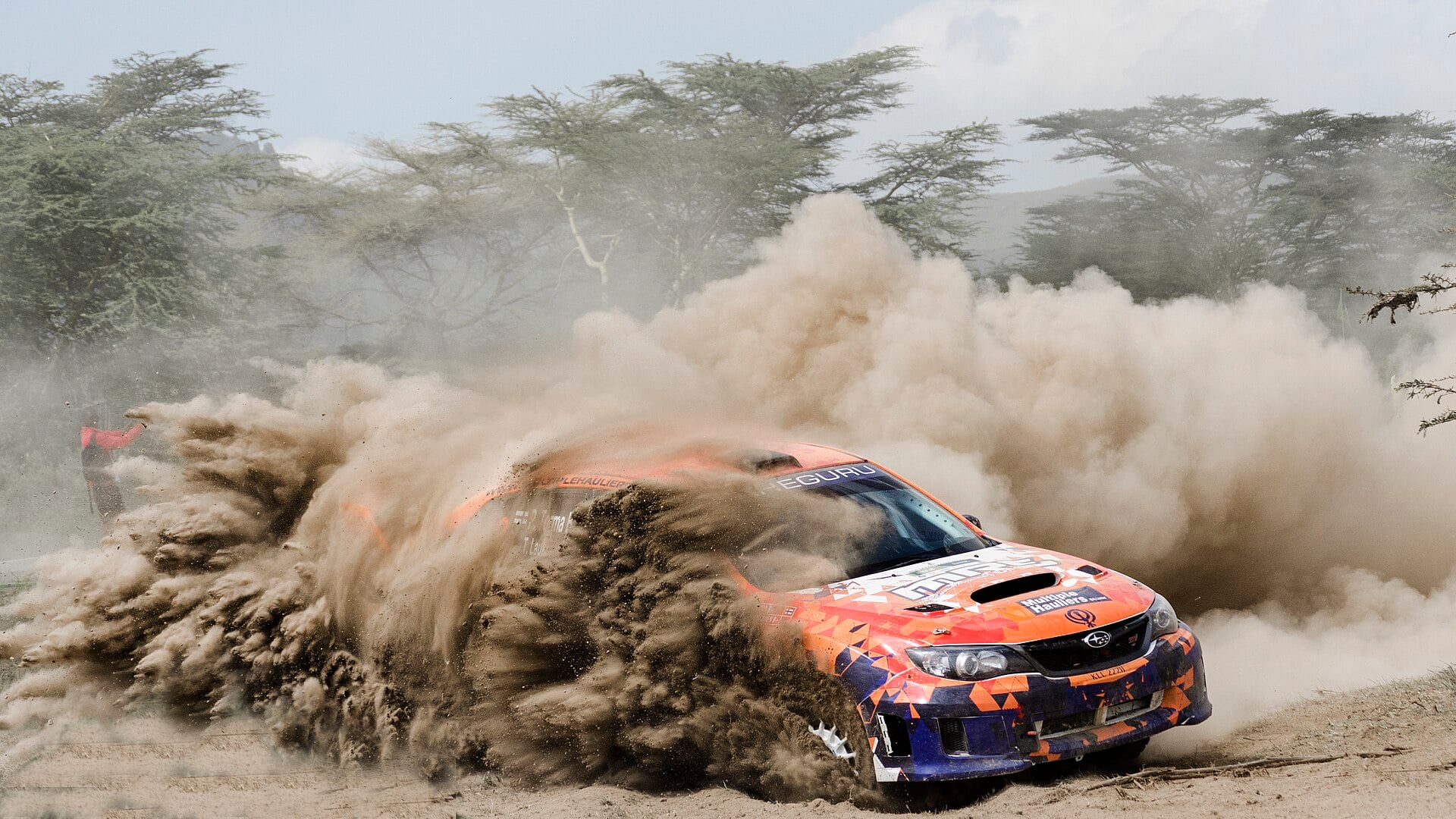 A rally car throws up a plume of dust on a gravel stage near Naivasha, Kenya, host of the 2027 WRC Safari Rally