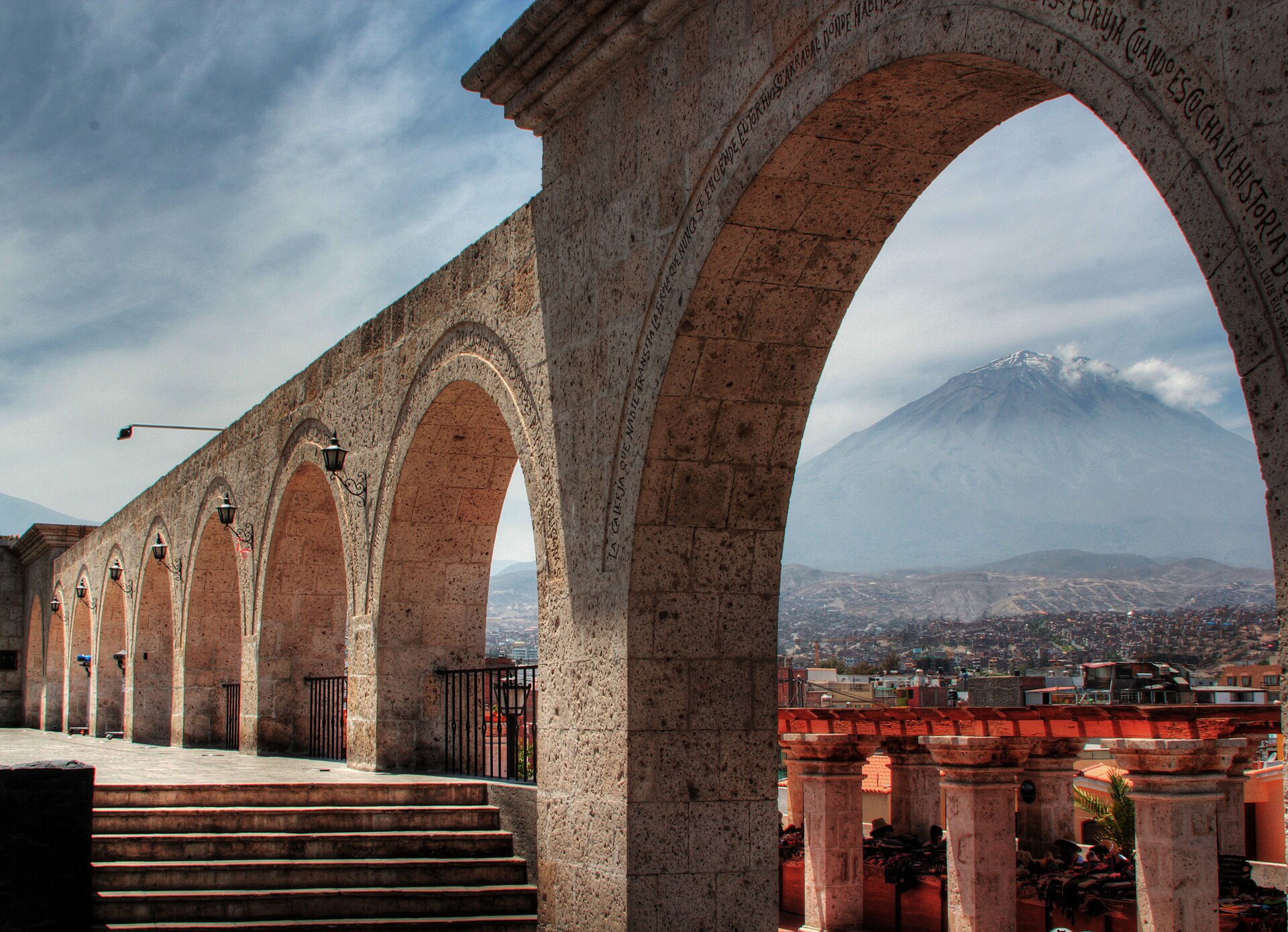 Stone arches of the Yanahuara lookout in Arequipa, Peru, with the Misti volcano in the background